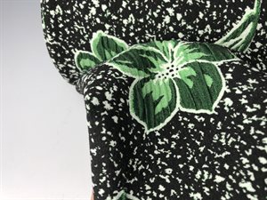 Effekt jersey - flotte grønne blade og blomster på hvid prikket bund